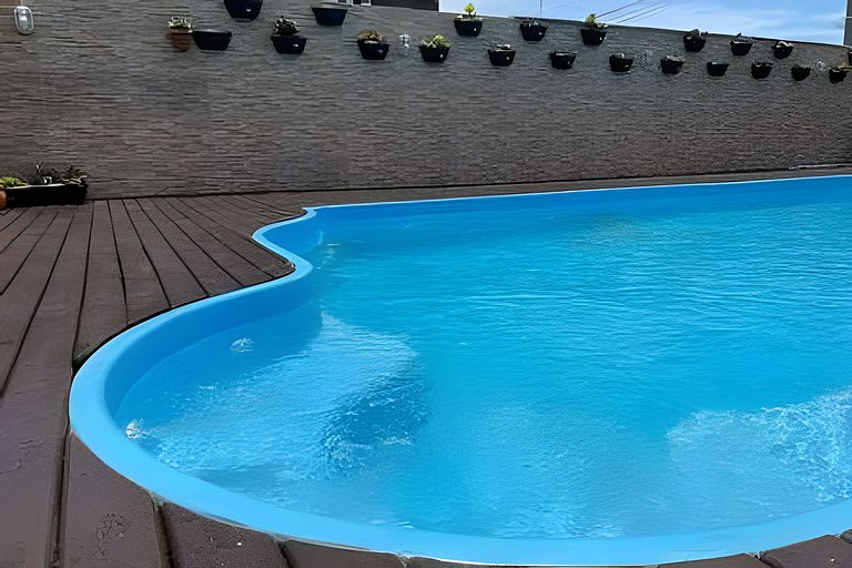Apartamento confortável com varanda espaçosa
